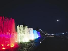 Multi-colored singing fountains on the promenade of Adler city photo