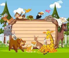 Empty wooden board with various wild animals in the forest vector