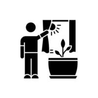 Providing sunlight for plant black glyph icon vector