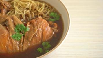 Noodles with braised chicken in brown soup video