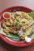 Oyster omelette and spicy sauce in Chinese style photo