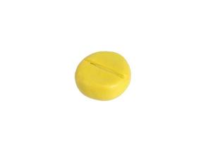 Miniature yellow drug model from Japanese clay on white background photo