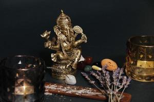 Table with occult attributes, top view. Ganesha figurine, photo