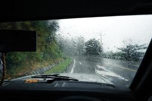 Mountain road in rainy and foggy day photo