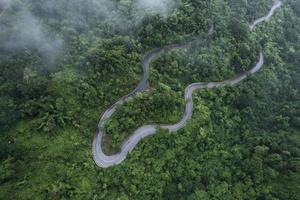 Mountain road in rainy and foggy day photo