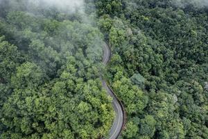 Mountain road in rainy and foggy day photo