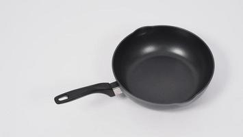 Frying pan on white background photo