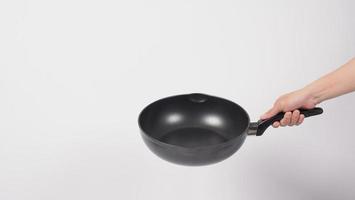Man hand on white background cleaning the non stick pan photo