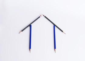 Home concept with pencil on white backgrounds photo