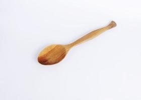 wooden spoon isolated on white backgrounds photo