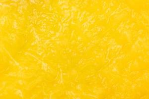 Texture of yellow juicy peach inside, peach pulp background. photo