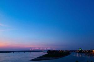 Hernando Desoto Bridge on the Mississippi River at dusk photo