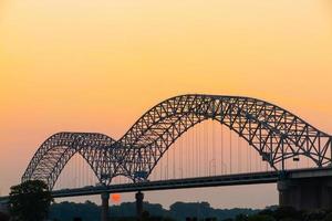 Hernando Desoto Bridge on the Mississippi River at dusk photo