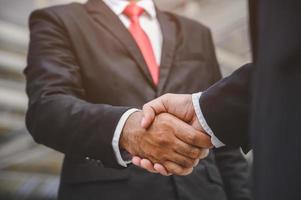 Business people shake hands photo
