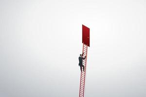 Businessman climbing ladder up to red door on wall to goal success. vector