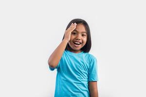 Little girl thinking in studio shot. photo