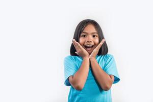 Little girl thinking in studio shot. photo