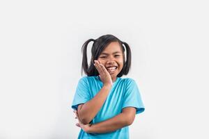 Portrait of Funny little girl acting in studio shot. photo