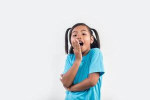 Portrait of Funny little girl acting in studio shot. photo