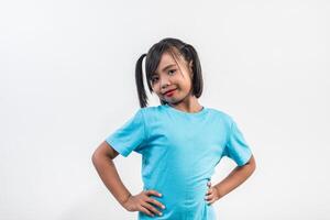 Portrait of Funny little girl acting in studio shot. photo