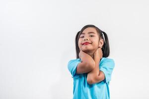 Portrait of Funny little girl acting in studio shot. photo