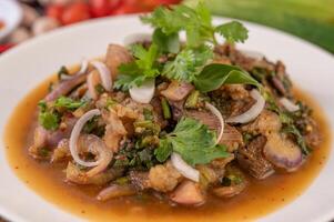 Spicy minced pork in a white plate. photo