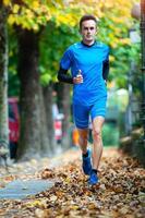 High-level cross-country runner during an autumn training session photo