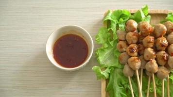 Grilled meat balls skewer with spicy dipping sauce video