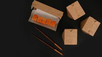 Asian food delivery. Packaging for sushi and woks