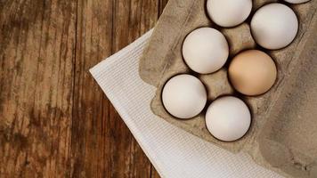 White eggs on wooden background photo
