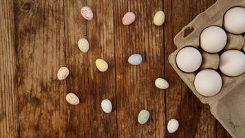 Chicken eggs in a cardboard tray and Easter decor photo