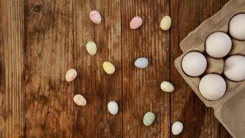 Chicken eggs in a cardboard tray and Easter decor photo