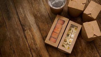 Asian food delivery. Packaging for sushi and woks photo