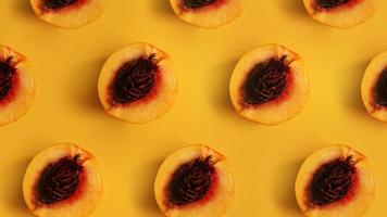 Ripe beautiful peaches with bones divided in half stacked in a row photo