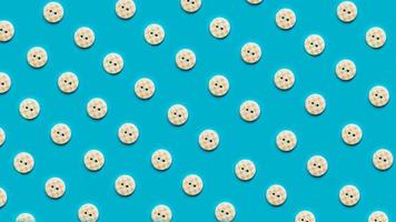 Top view of buttons arranged on blue background photo