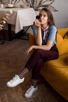 Make-up artist with brushes sitting on the couch photo