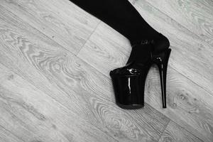 Hhigh boots on platform and heel on the parquet floor during training photo