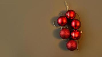 Red christmas balls on a brown-grey backgroud, copy space photo