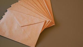 Brown craft envelopes on a gray background photo