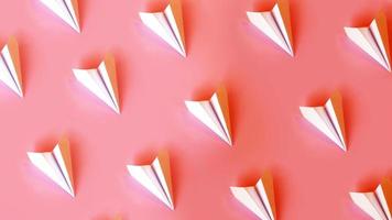 Paper planes on a coral background. Travel or smm concept photo