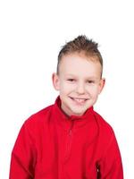 A beautiful boy smiles on a white background isolated photo