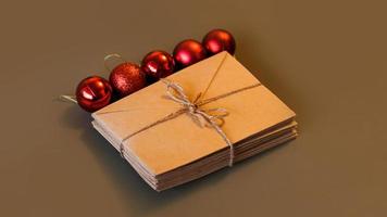 Christmas composition. Craft envelopes and red balls. Stack of letters photo