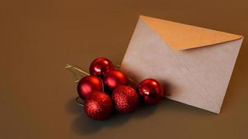 Christmas composition. Craft envelope and red balls photo