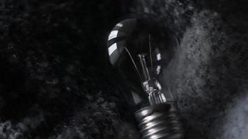 Light Bulb On a gray knitted background photo