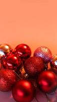 Collection of red Christmas balls on a pink background photo