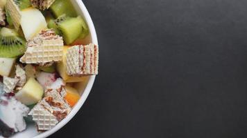 Close up desert with fresh fruit and ice cream photo