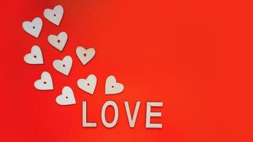 Valentines Day background with red hearts and letters love photo