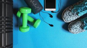 Fitness background. Equipment for gym and home. Blue background photo