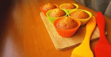 Simple mini muffins in colorful silicone bakeware. Kitchen photo