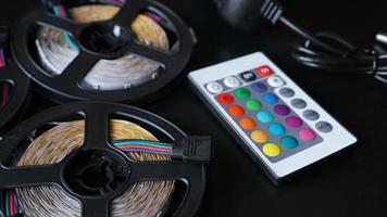 Led strip coils closeup. Diode with control panel for switching colors photo